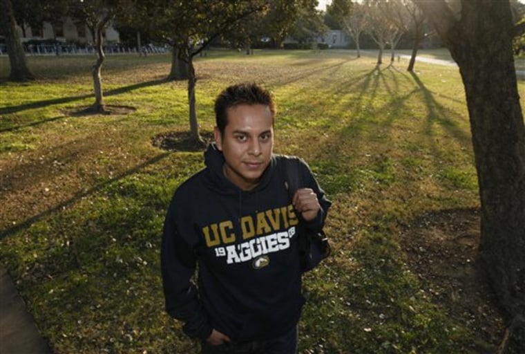 In this Dec. 12, 2011 photo, Irvis Orozco, 24, a senior studying international relations at the University of California, Davis, poses on campus in Davis, Calif. A new law that will take effect Jan. 1, 2012, will allow Orozco, who was brought to the country illegally from Mexico when he was an infant, to receive private financial aid at California's public colleges. (AP Photo/Rich Pedroncelli)